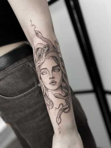 18 Snake Tattoo Hand Ideas for a Touch of Mystery