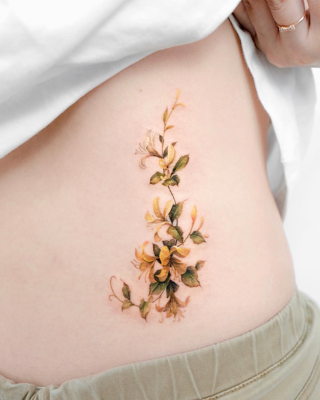 29 Honeysuckle Tattoo Ideas with Fine Line, Neo Traditional, Coral, and American Traditional Designs