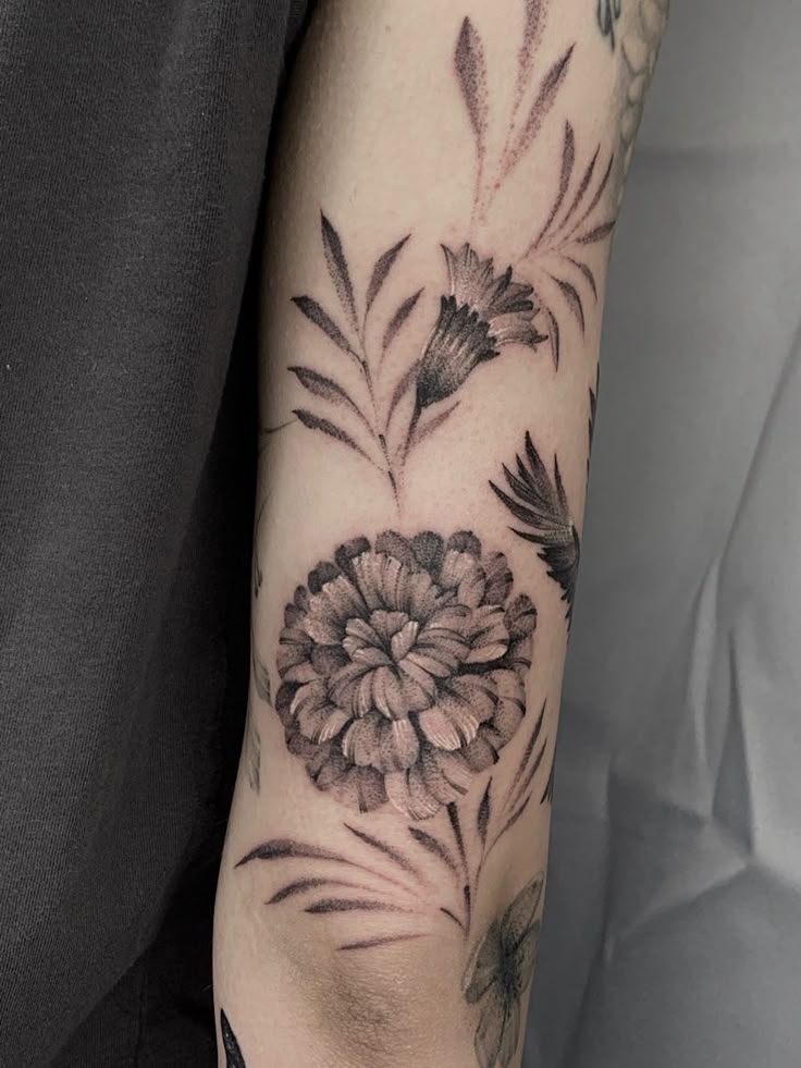 26 Marigold Tattoo Ideas for Every Style Fineline, Realistic, Black and White, Traditional, and Color Designs