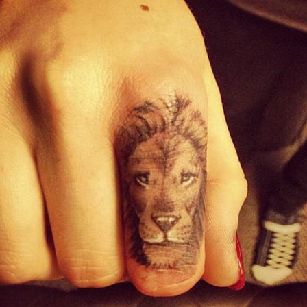 Fierce and Detailed: 19 Lion Tattoo on Finger Ideas