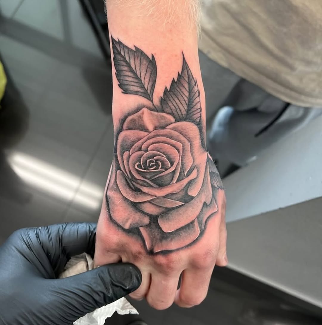 27 Rose Hand Tattoo Ideas: From Classic Black-and-Gray to Bold Narrative Pieces