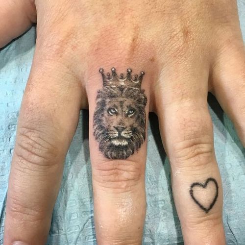 Fierce and Detailed: 19 Lion Tattoo on Finger Ideas