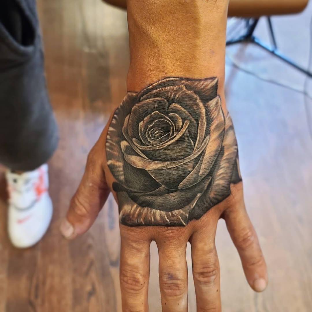 27 Rose Hand Tattoo Ideas: From Classic Black-and-Gray to Bold Narrative Pieces