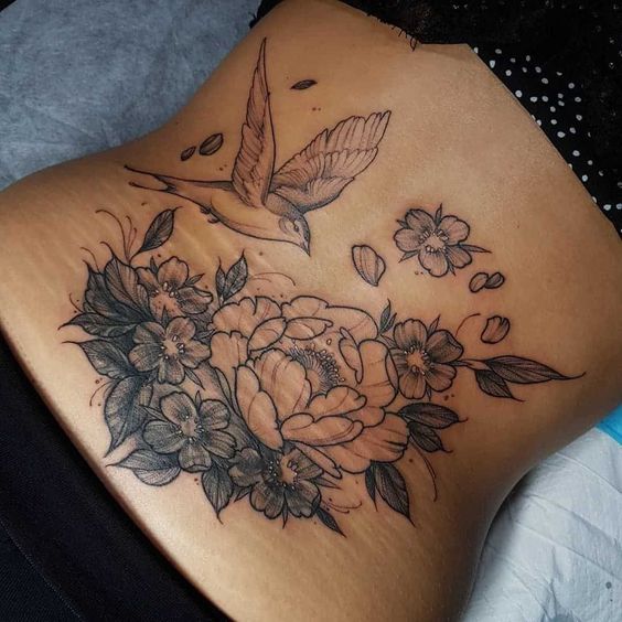 18 Stunning Lower Back Tattoo Ideas for Women & Men: Classy & Artistic Inspiration