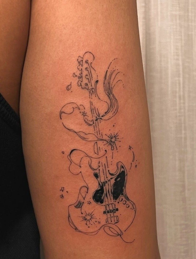 31 Guitar Tattoo Ideas for Music Lovers: From Minimalist Designs to Bold Sleeve Art