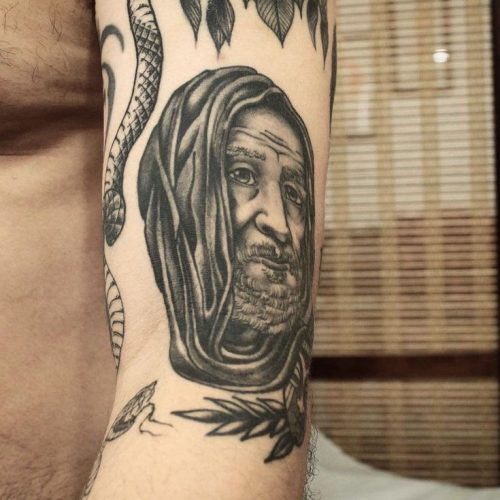 Explore Top 18 Afro Tattoo Designs of : Cultural Heritage Meets Modern Artistry