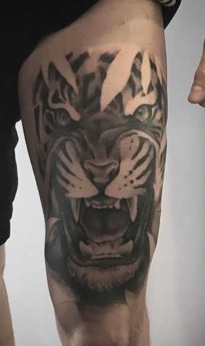 25 Tiger Tattoo on Thigh Ideas
