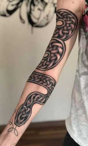 29 Mesmerizing Snake Tattoo Design Ideas