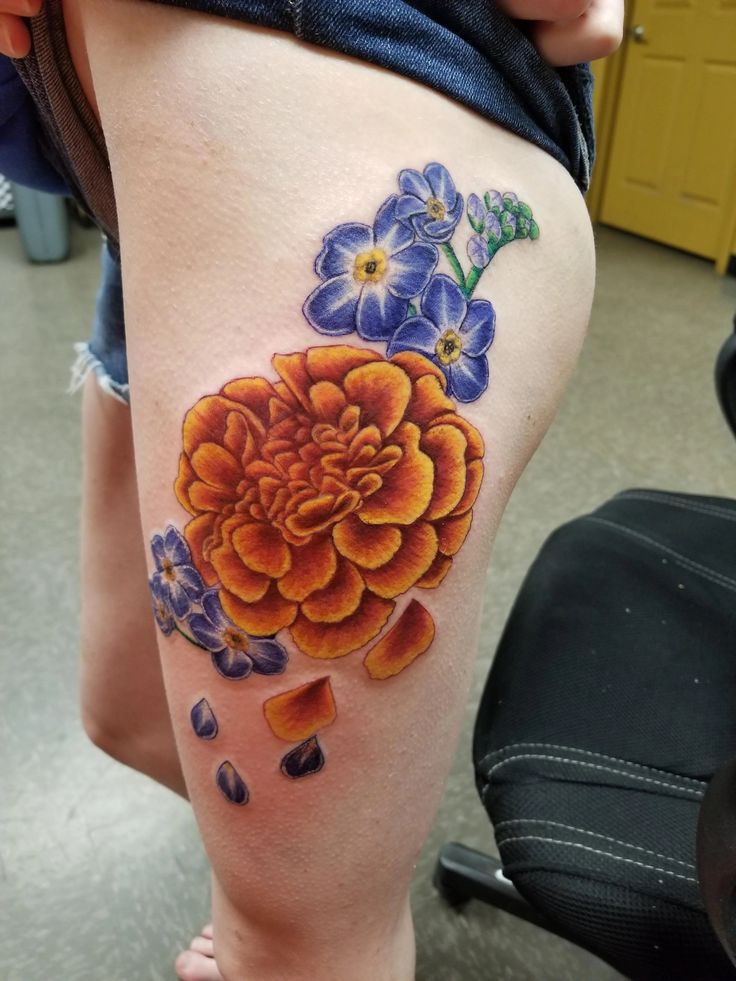 26 Marigold Tattoo Ideas for Every Style Fineline, Realistic, Black and White, Traditional, and Color Designs