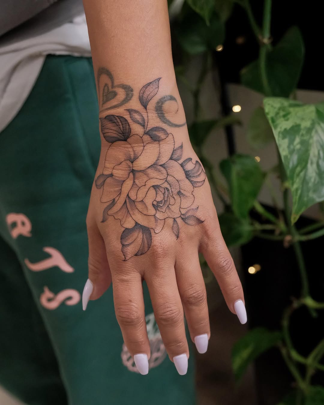 27 Rose Hand Tattoo Ideas: From Classic Black-and-Gray to Bold Narrative Pieces